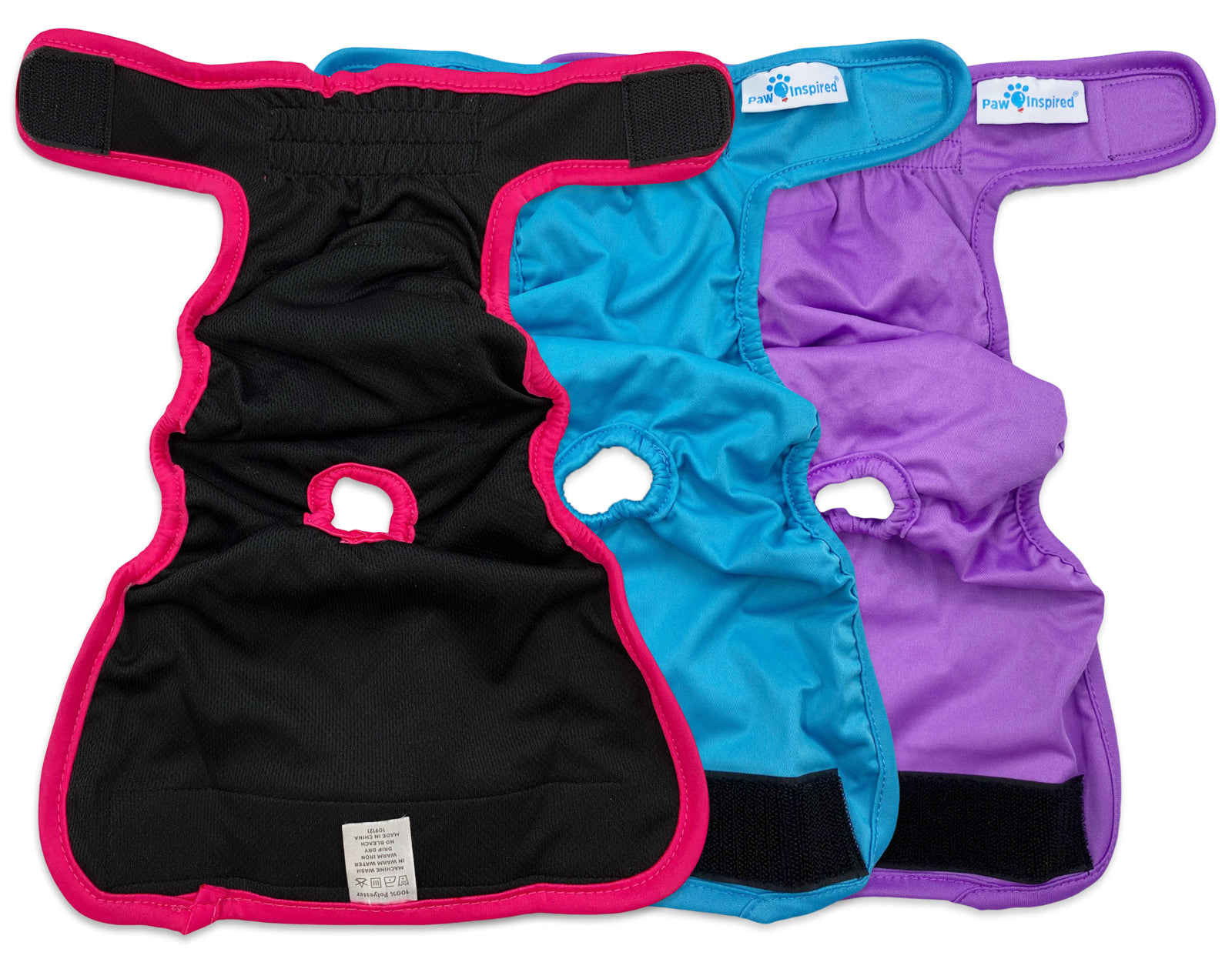 Red, blue, and purple dog diapers laid flat and open to show the interior, tail holes, and inner lining details.