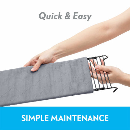 Hands sliding a Paw Inspired Exit Ramp fleece cover onto a wire ramp, showcasing simple maintenance.