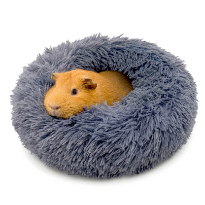 A cute brown guinea pig burrowed comfortably inside a dark grey Paw Inspired Furr-O plush pet bed.