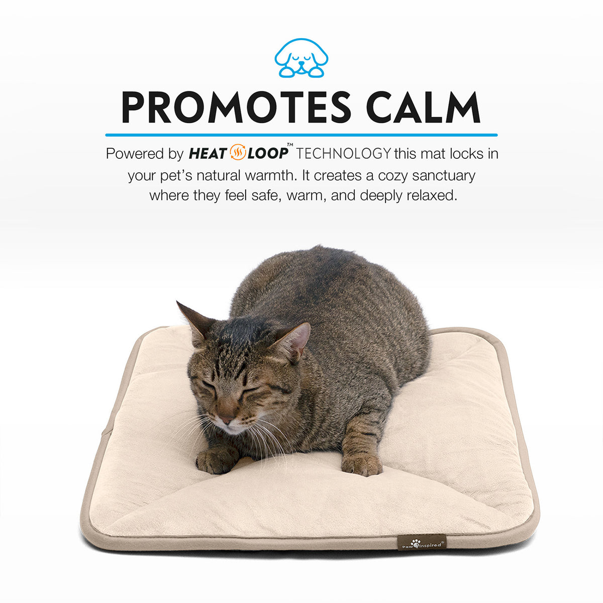 A brown tabby cat relaxing snugly on a tan Paw Inspired self-heating pet mat.