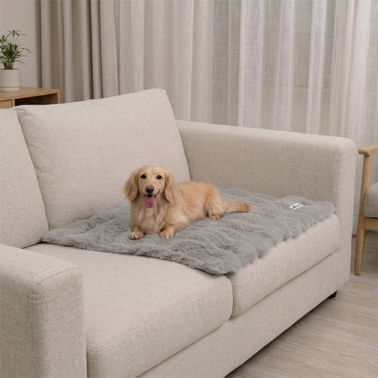 Paw Inspired Waterproof Dog Blanket for couch and sofa protection featuring a long-haired dog resting on a plush grey mat.