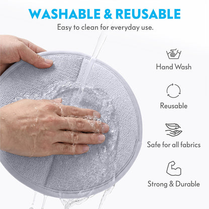 Close-up of a person hand washing the Paw Inspired pet hair remover glove under running water, highlighting that it is washable, reusable, and safe for all fabrics.